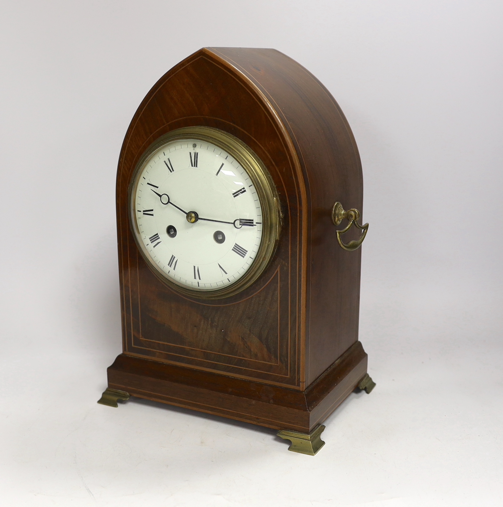A late 19th century mahogany lancet shaped mantel clock, striking on a coiled gong, 29cm high